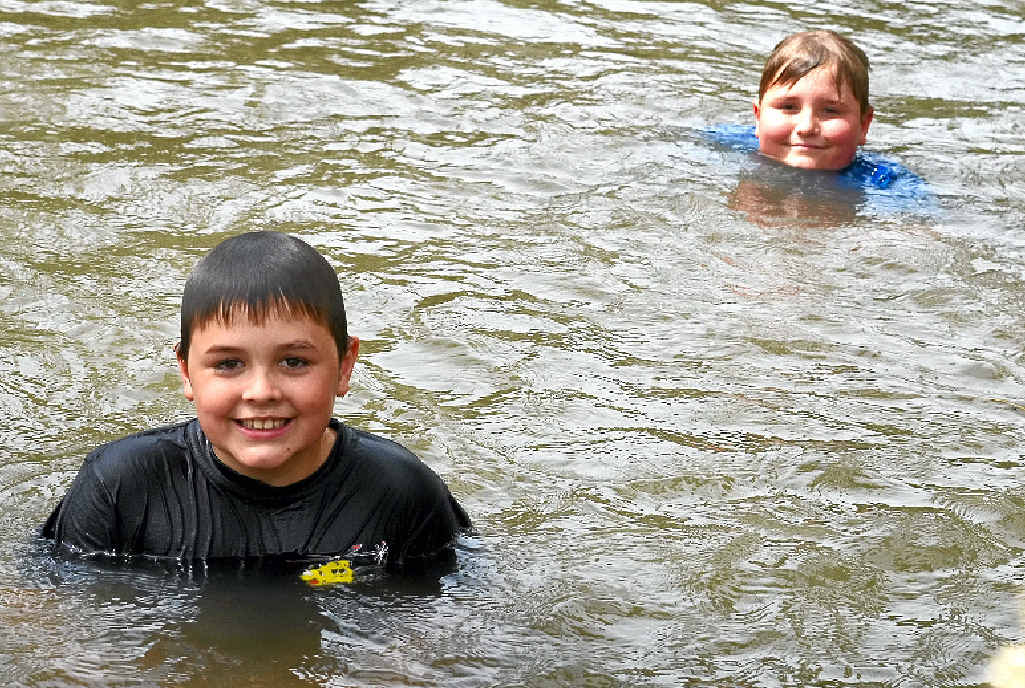 COOL IN THE CONDAMINE: Jack Benz and Tyson Goldspink keep cool in the Condamine River as temperatures soared yesterday.
